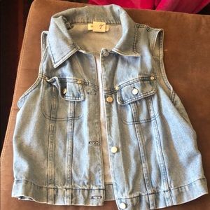 Worn denim vest.